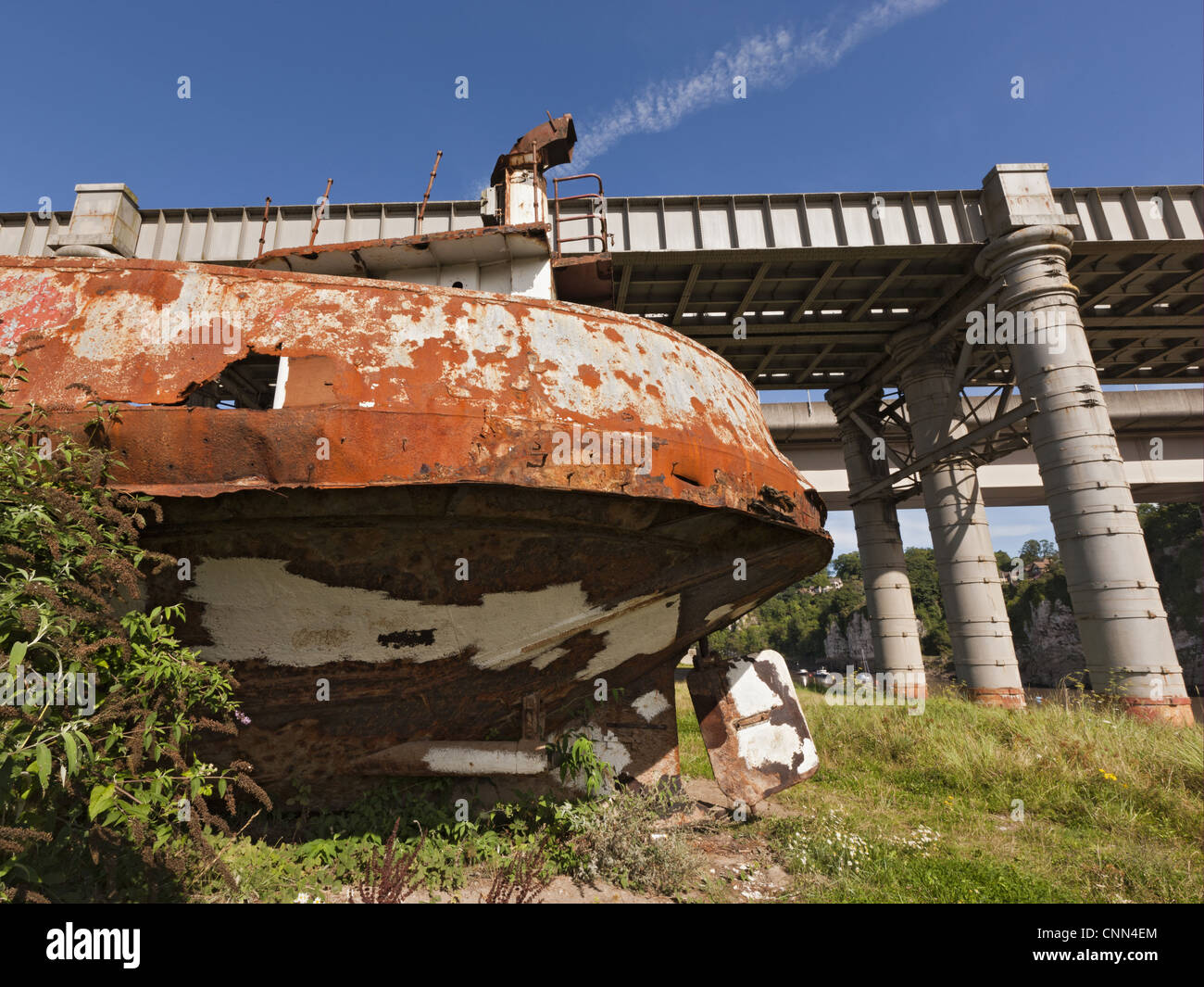 Rusting hulk of old ferry boat on bank of river, Chepstow, River Wye, Wye Valley, Monmouthshire, Wales, august Stock Photo