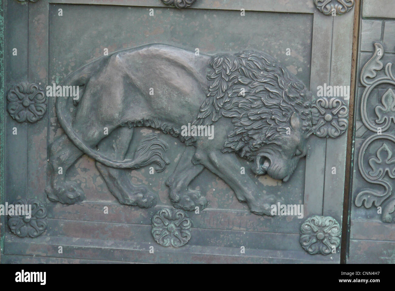 Lion detail bronze cathedral door in historic town Our Lady Maria Cathedral Vor Frue Maria Domkirke Ribe Jutland Denmark may Stock Photo