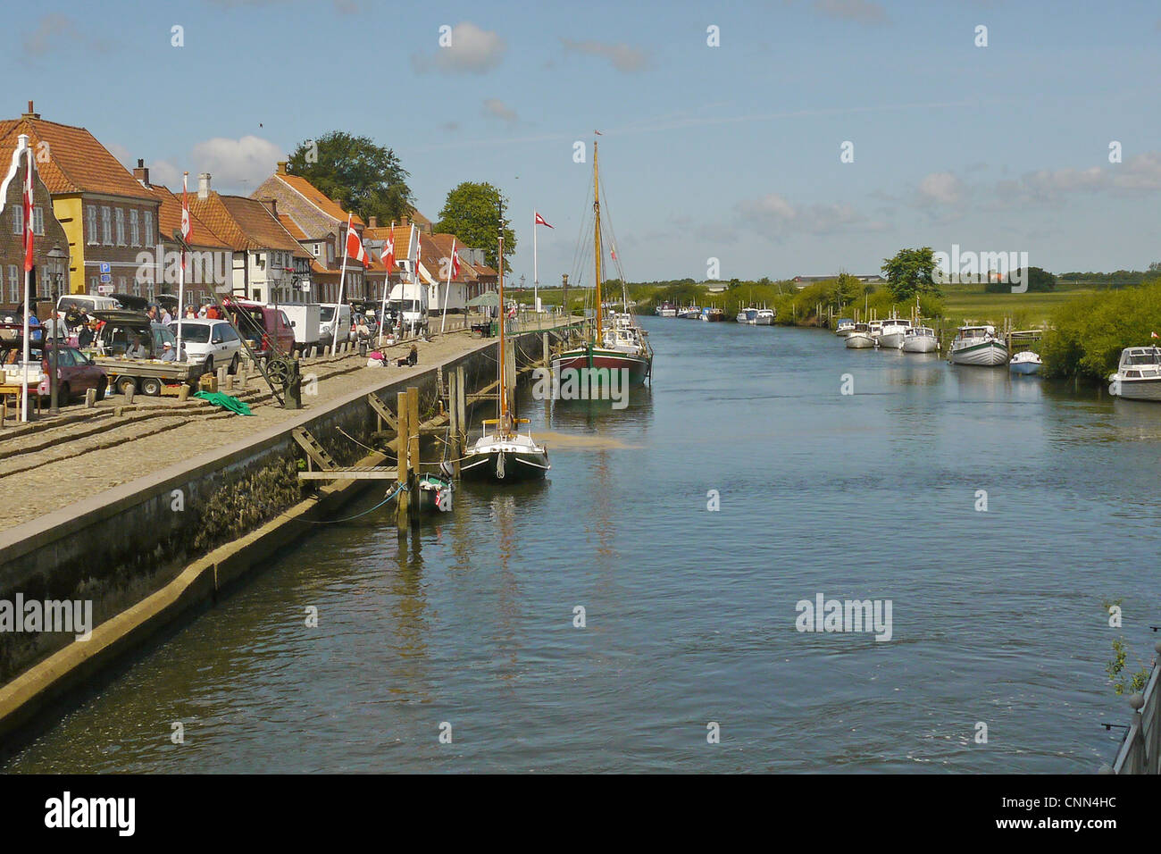 View of river, boats and quay in historic town, Ribe, Jutland, Denmark, may Stock Photo