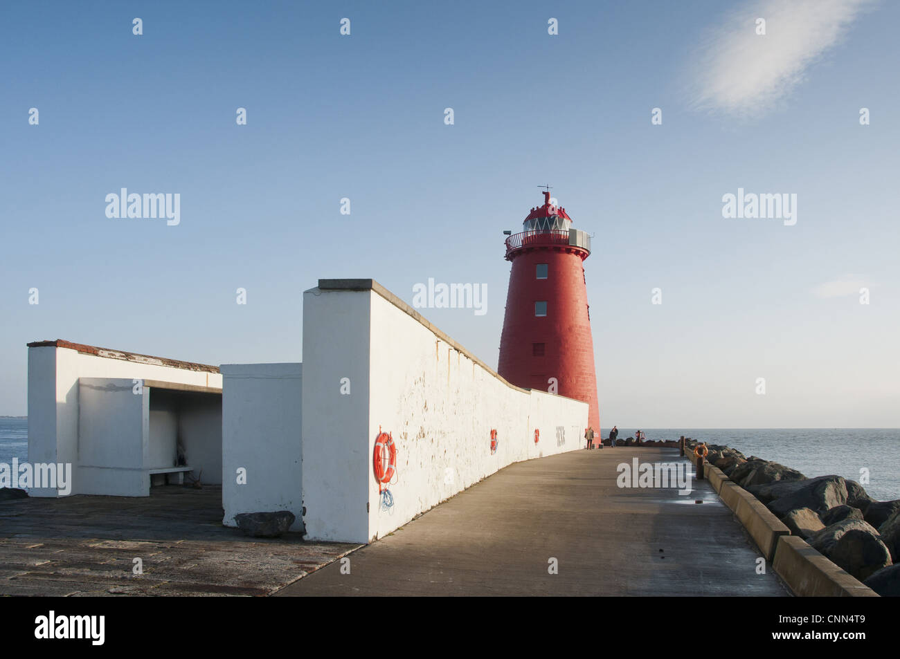 Lighthouse on sea wall protecting harbour entrance Poolbeg Lighthouse