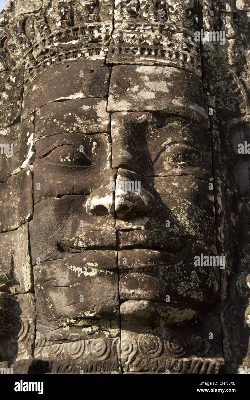 Large sculpture of head in Khmer temple, Bayon, Angkor Thom, Siem Riep, Cambodia Stock Photo