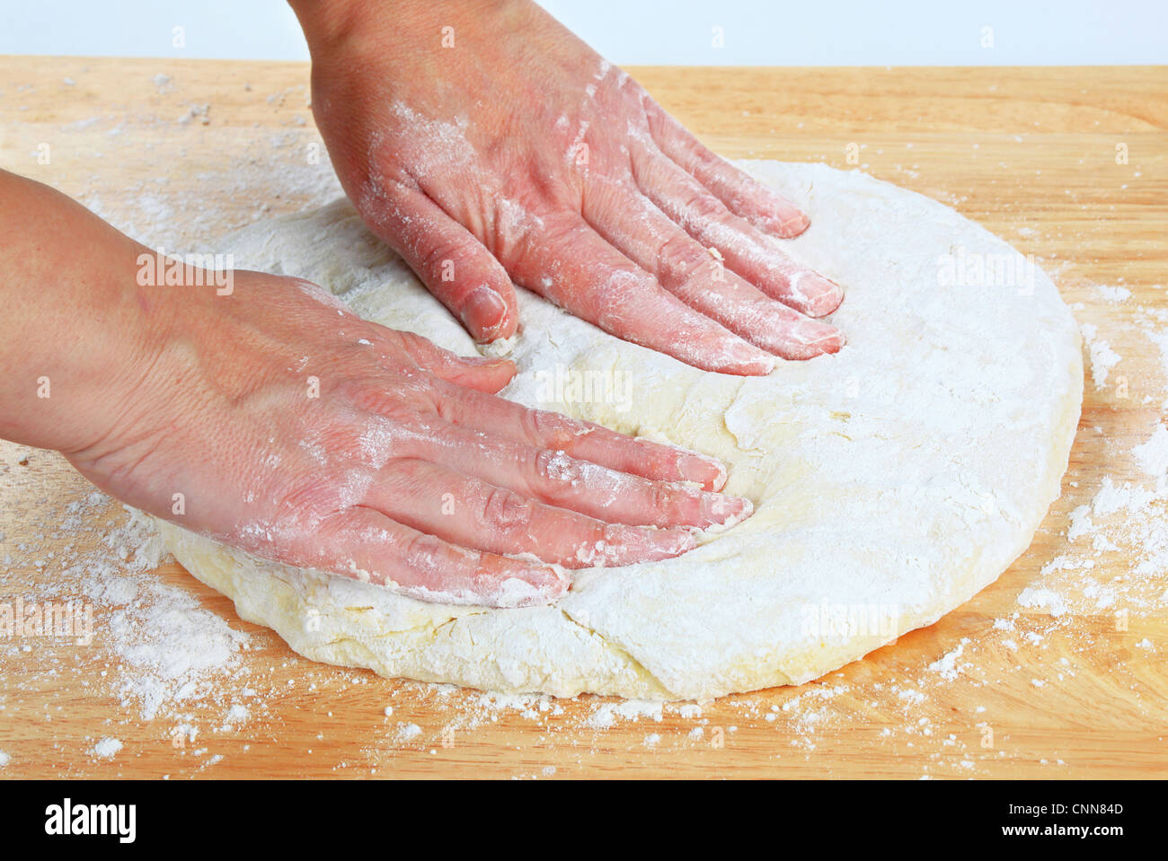 Cook making yeast pizza dough Stock Photo