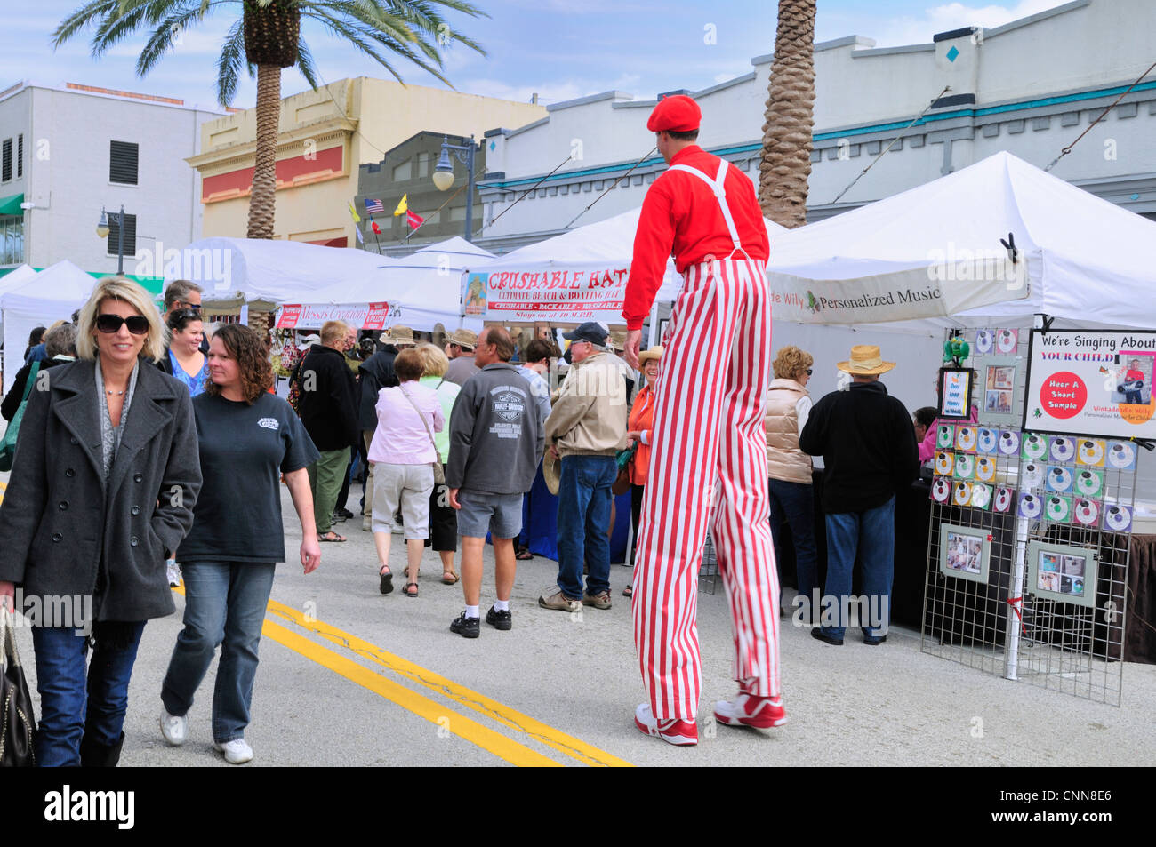 Man on stilts mingles with the crowd at the 50th annual Art Fiesta, New