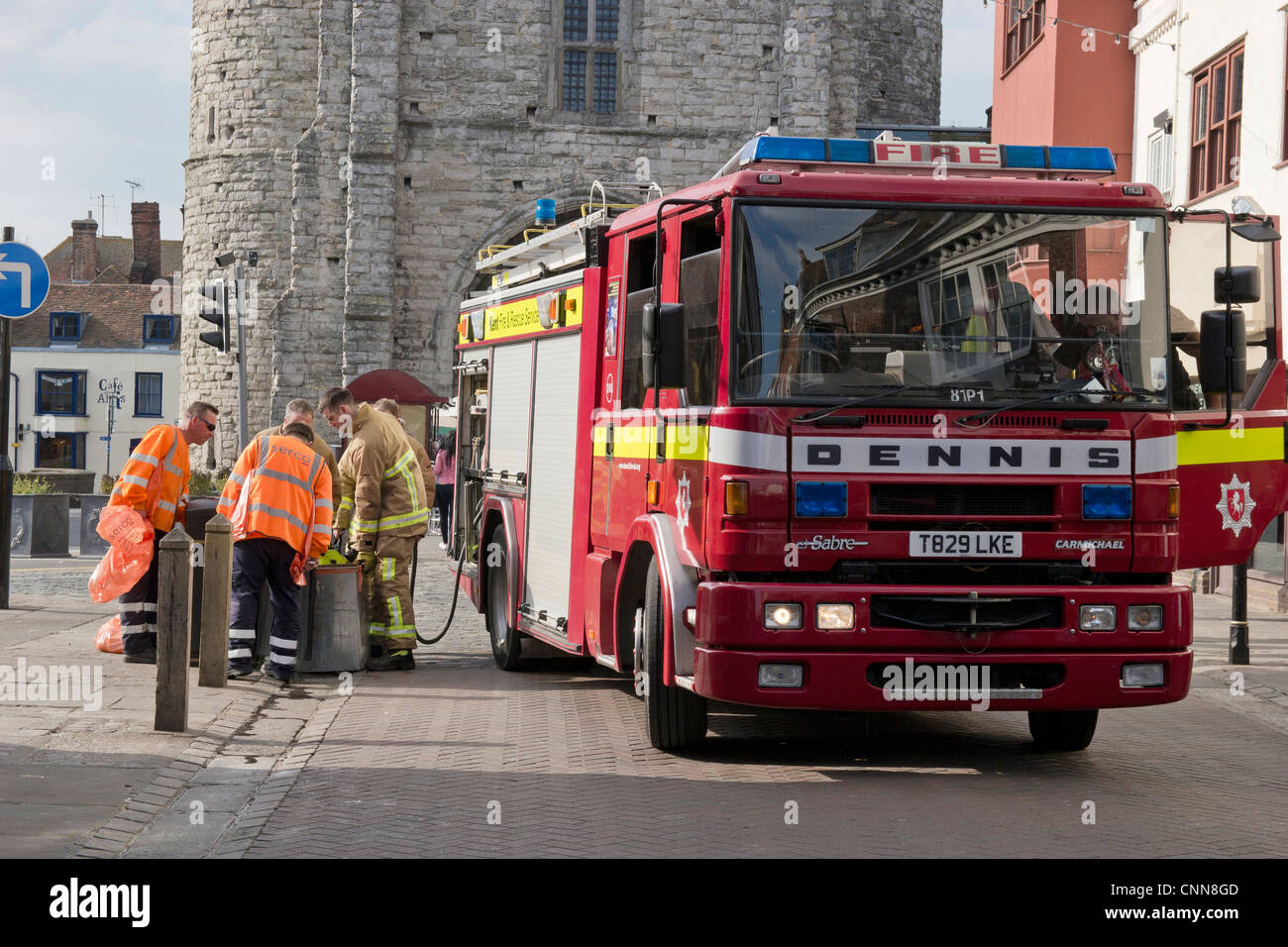 Fire Brigade on Call City Centre small fire in rubbish bin. Emergency Services Stock Photo