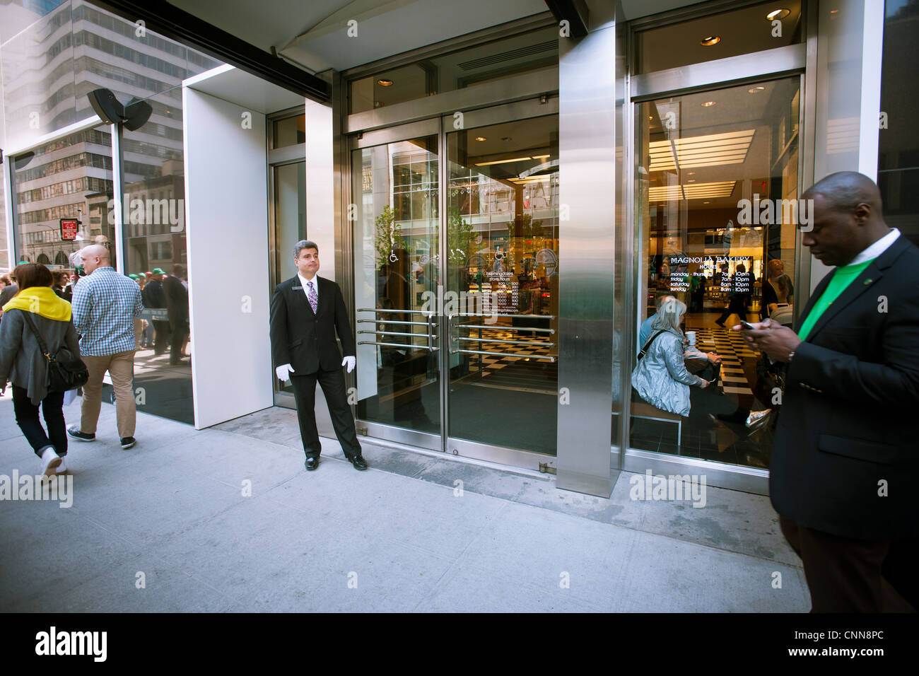 A doorman, center, at the entrance to Bloomingdale's flagship store in the Upper East Side