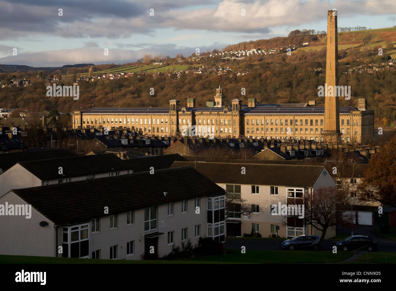 Salts Mill in Saltaire, looking down from Shipley, showing rows of terraced houses leading to the Mill. Stock Photo