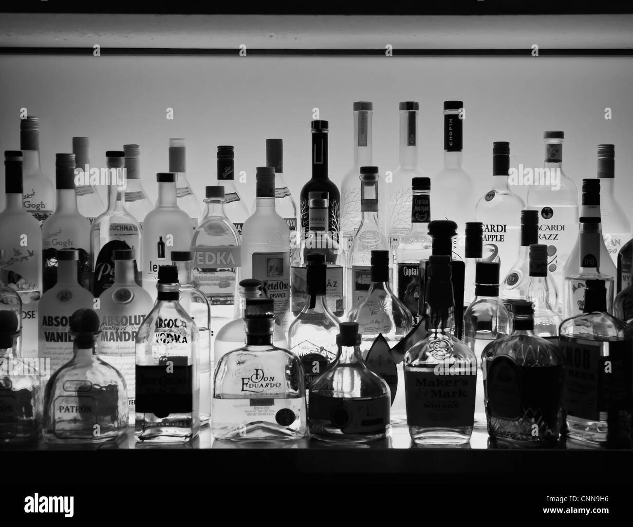 different alcoholic drinks inside a bar - black and white Stock Photo