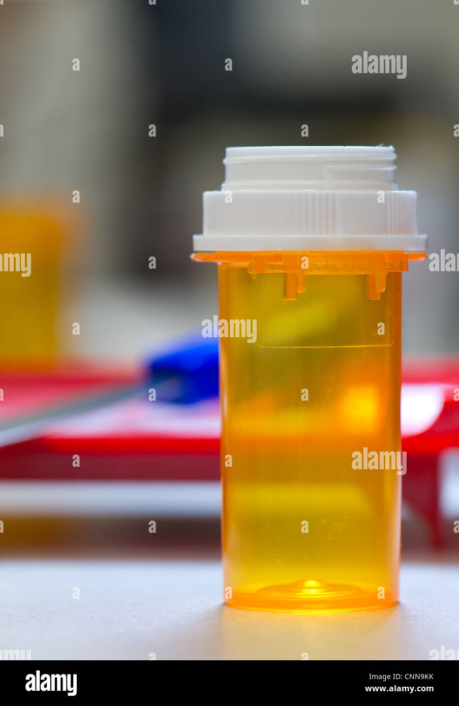 pharmacy bottle with a counting tray in the background, inside a pharmacy Stock Photo