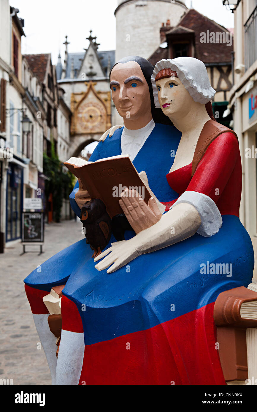 Statue of Nocolas Retif of Breton reading a book in the town centre, Auxerre, Burgundy, France Stock Photo