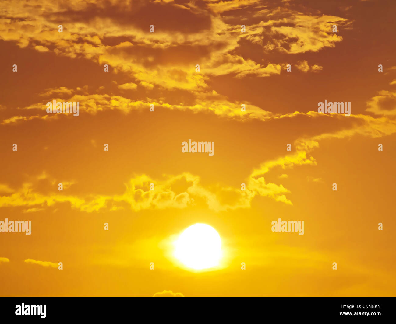 Sun shining through clouds Stock Photo - Alamy