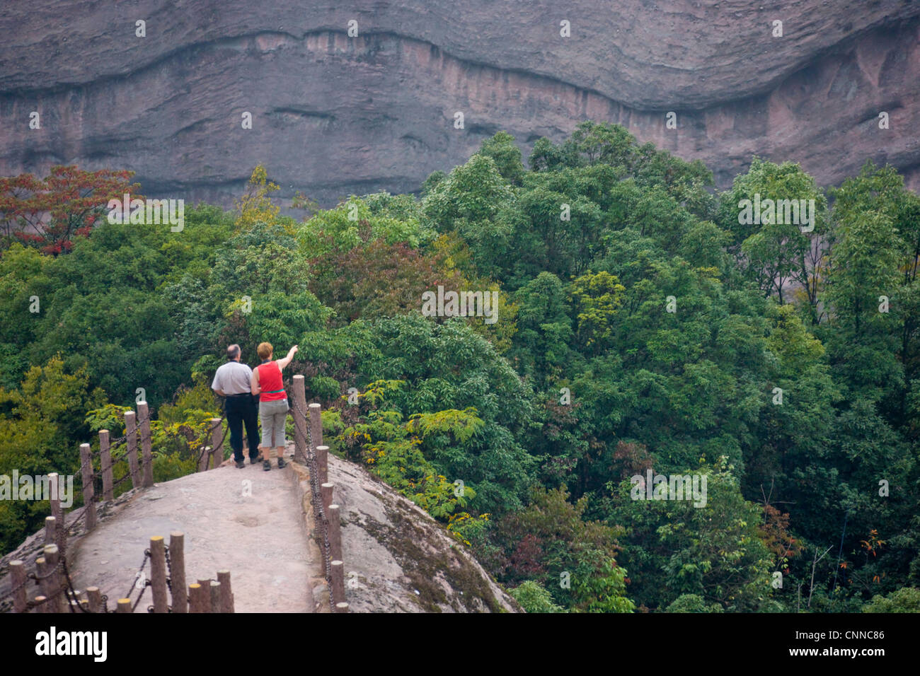 Tourists watching Red Sand Stone topography, Ziyuan National Geo Park ...