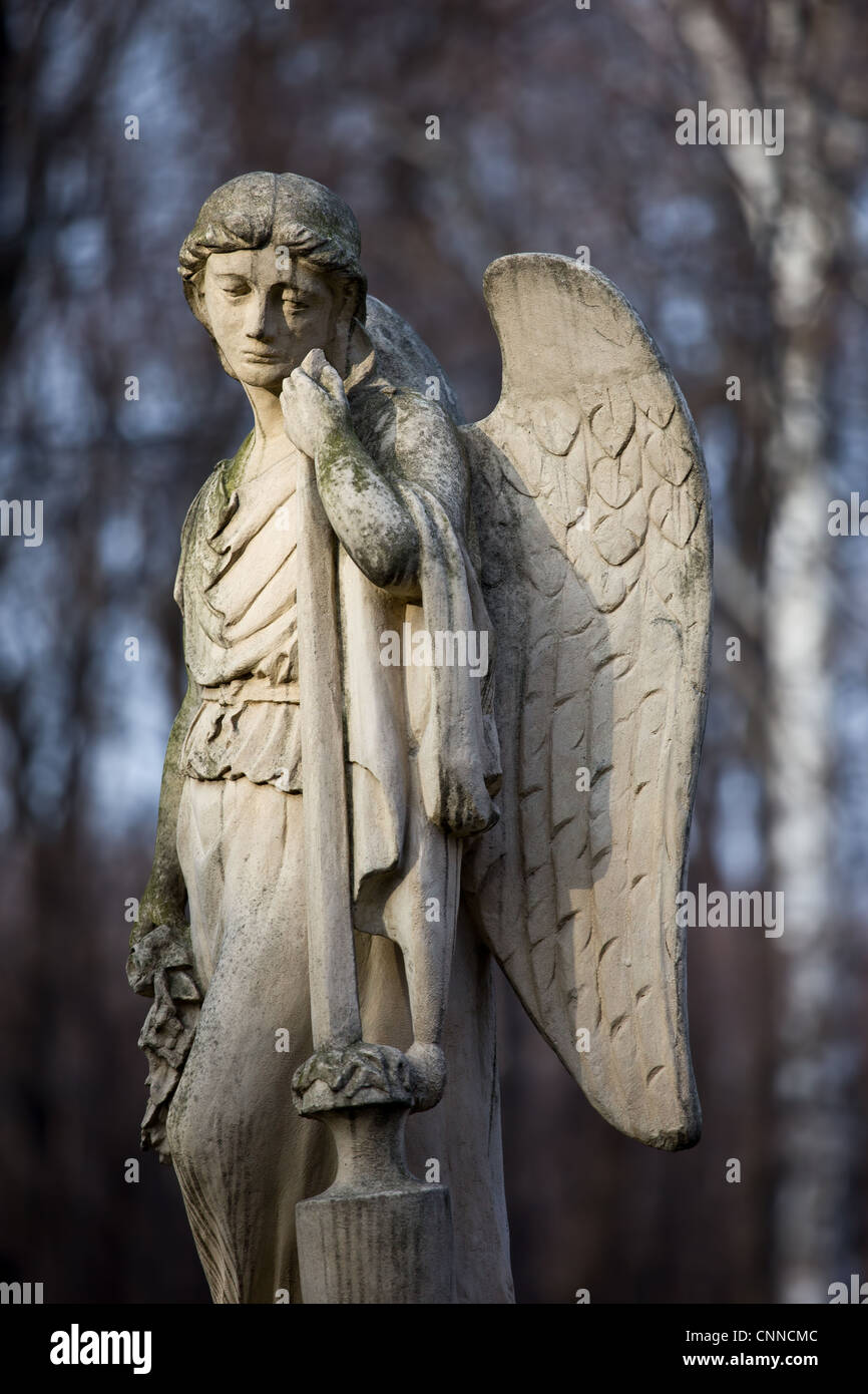 19th century statue of an angel with sad expression on face at Warsaw ...