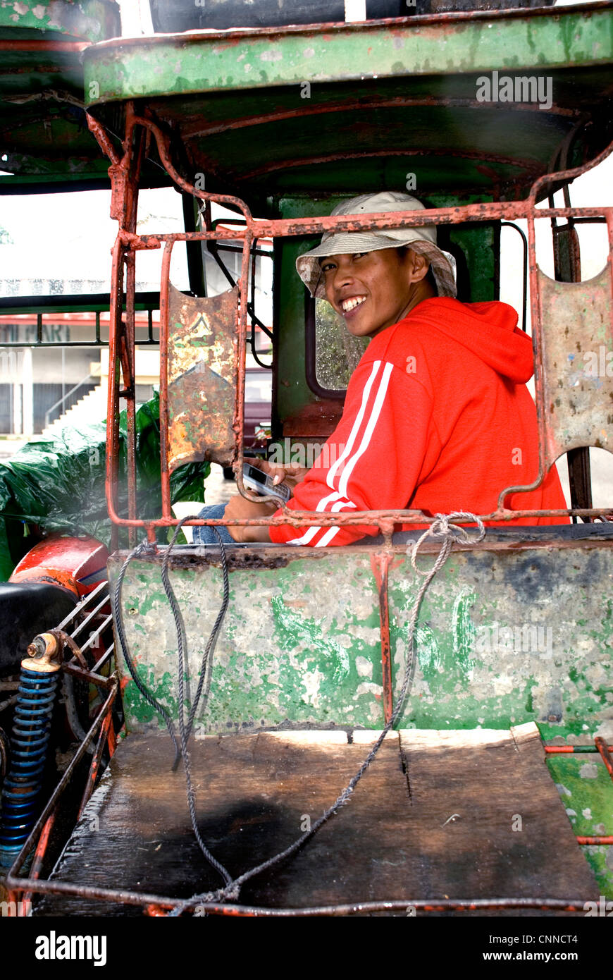 philippines, siquijor island, larena town, boy in tricycle Stock Photo