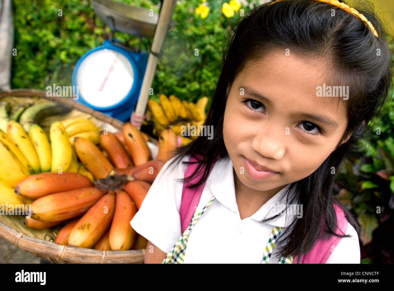 philippines, siquijor island, larena town, girl with fruit stall Stock Photo
