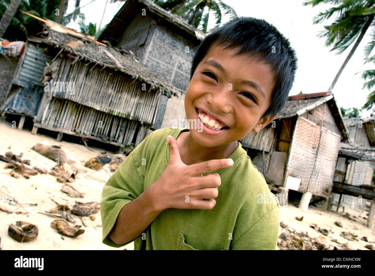 philippines, siquijor island, boy in front of fisher's house Stock Photo