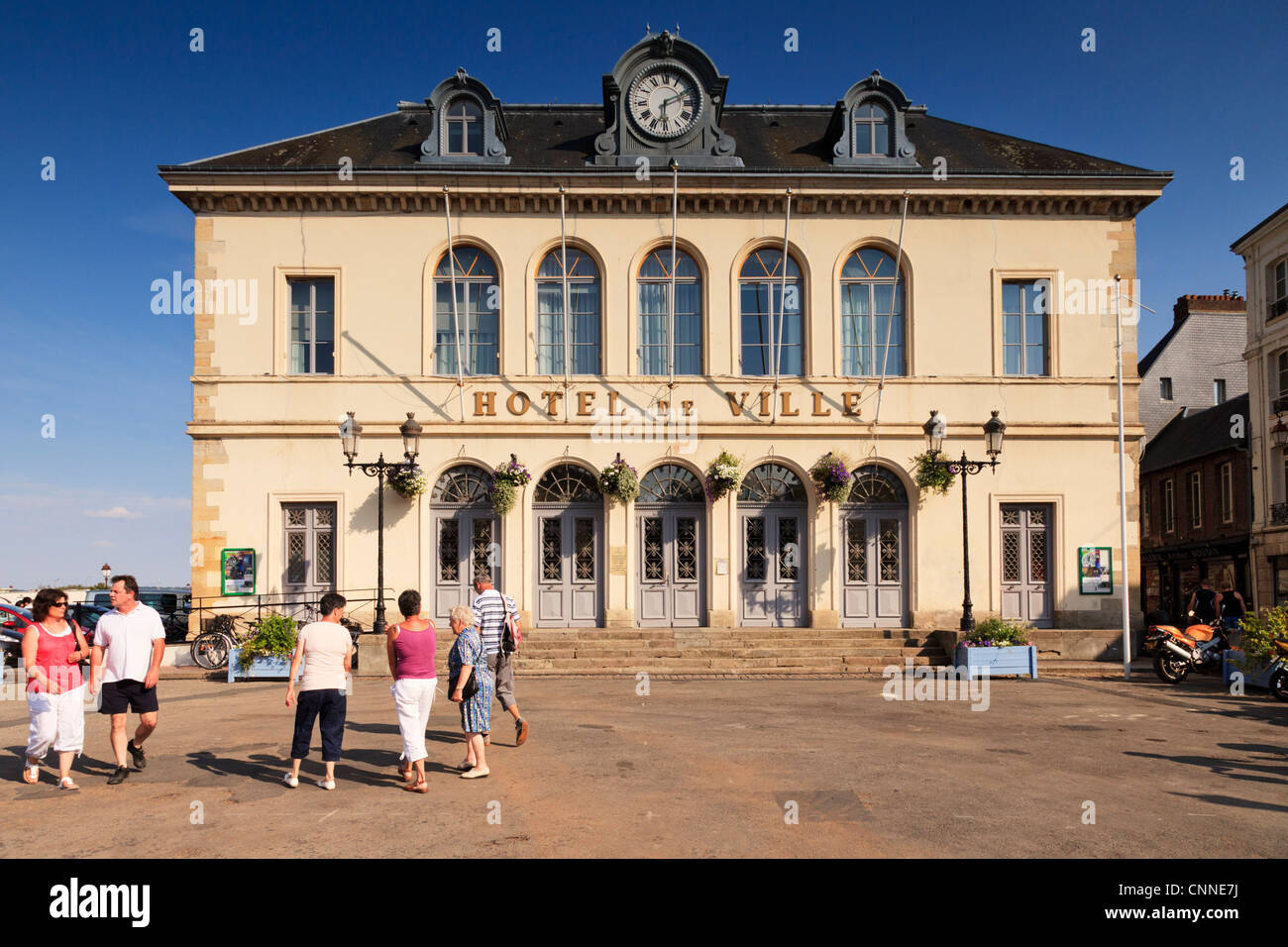 Hotel de Ville Honfleur Normandy France, people walking in the foreground. Stock Photo