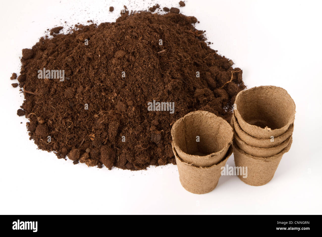 pile of soil and peat pots for seedlings Stock Photo - Alamy