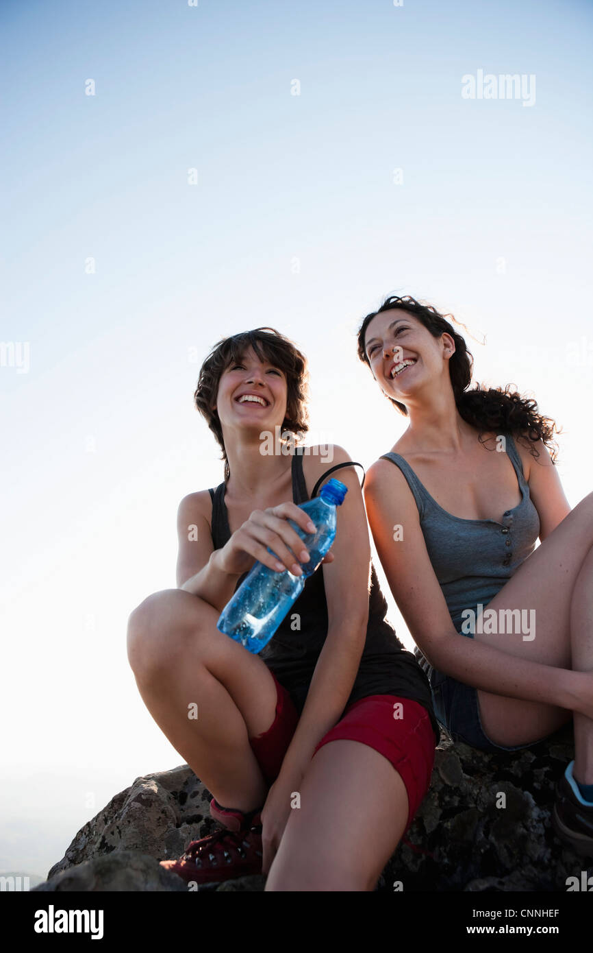 Resting On Rocks Hikers resting on rock Stock Photo - Alamy