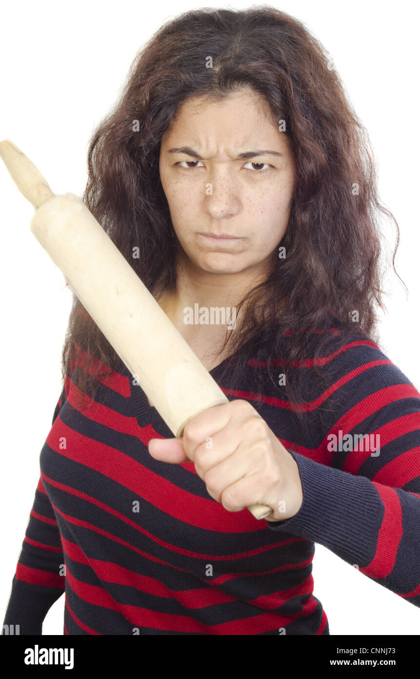 young woman defends herself with a rolling pin Stock Photo