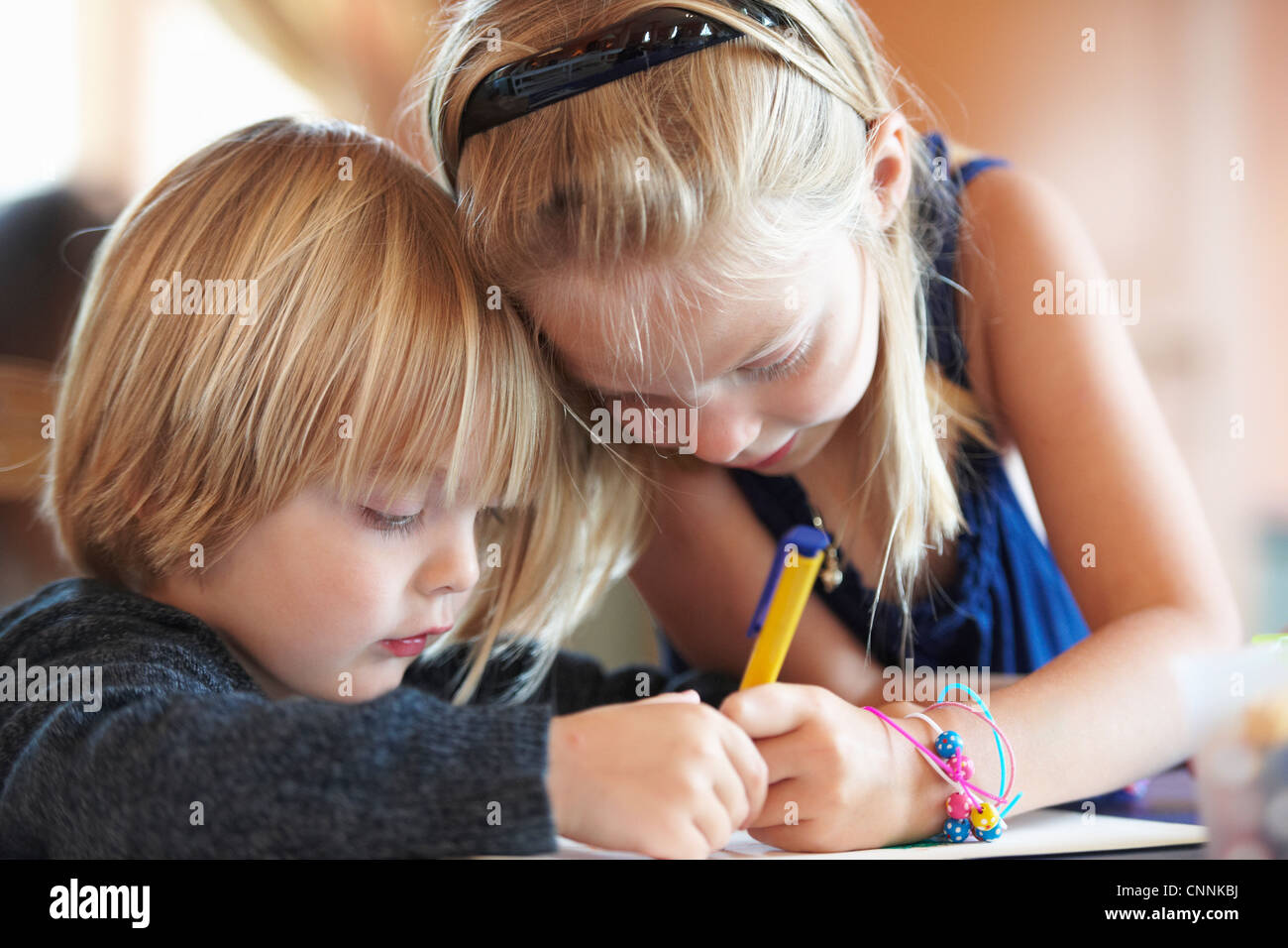 Close up of children drawing indoors Stock Photo - Alamy