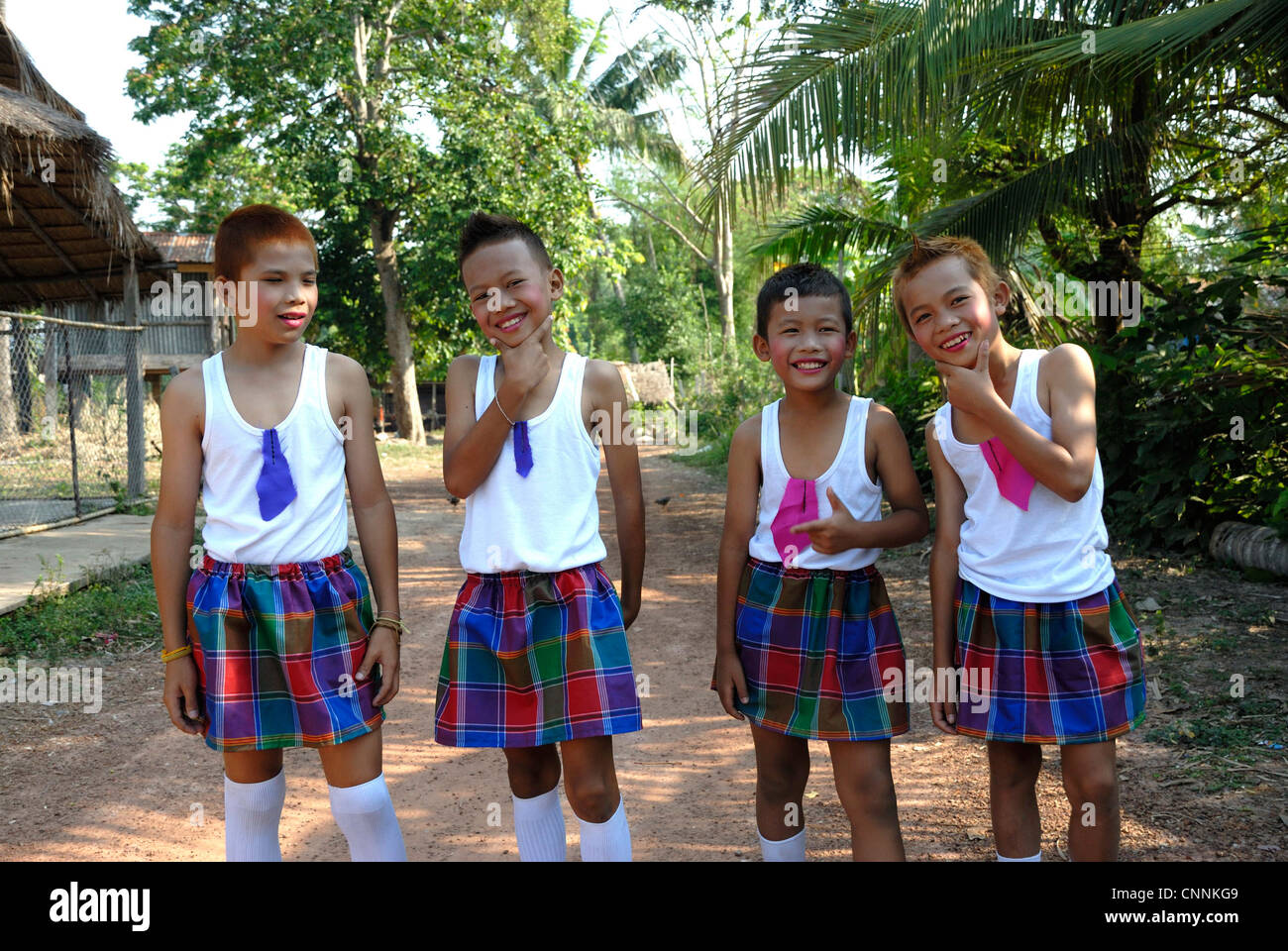 young boys dressed as girls in issan costume for songkhran festival Stock Photo