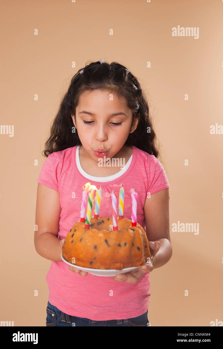 Portrait of Girl Blowing Out Candles Stock Photo Alamy