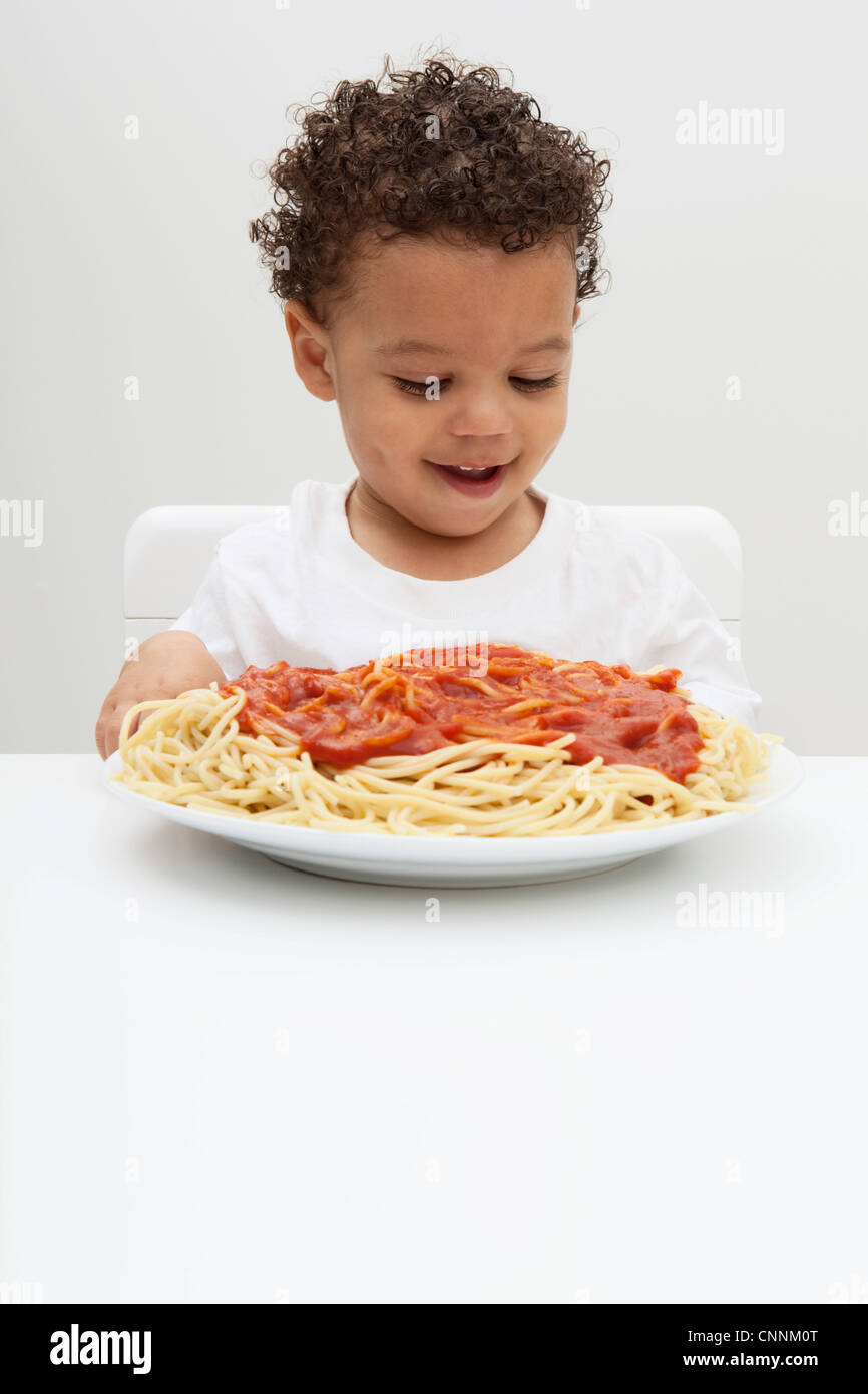 Boy with Plate of Spaghetti Stock Photo