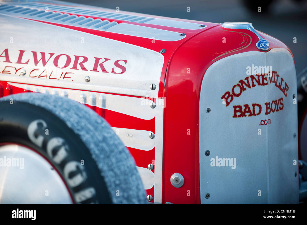 front of classic vintage American racing car at Bonneville salt flats Stock Photo