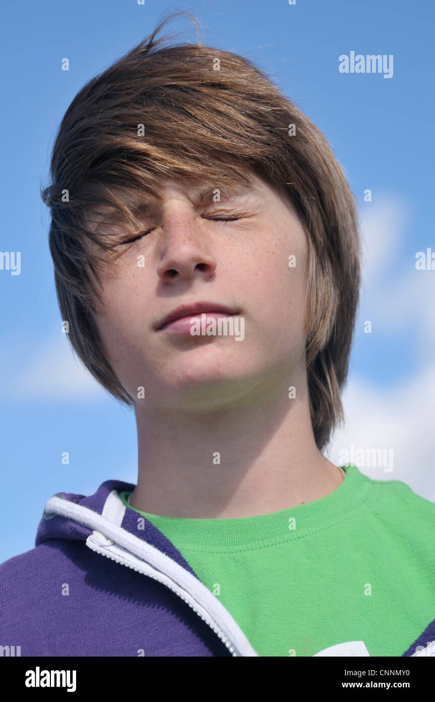Close-up Portrait of Boy with Eyes Closed Stock Photo