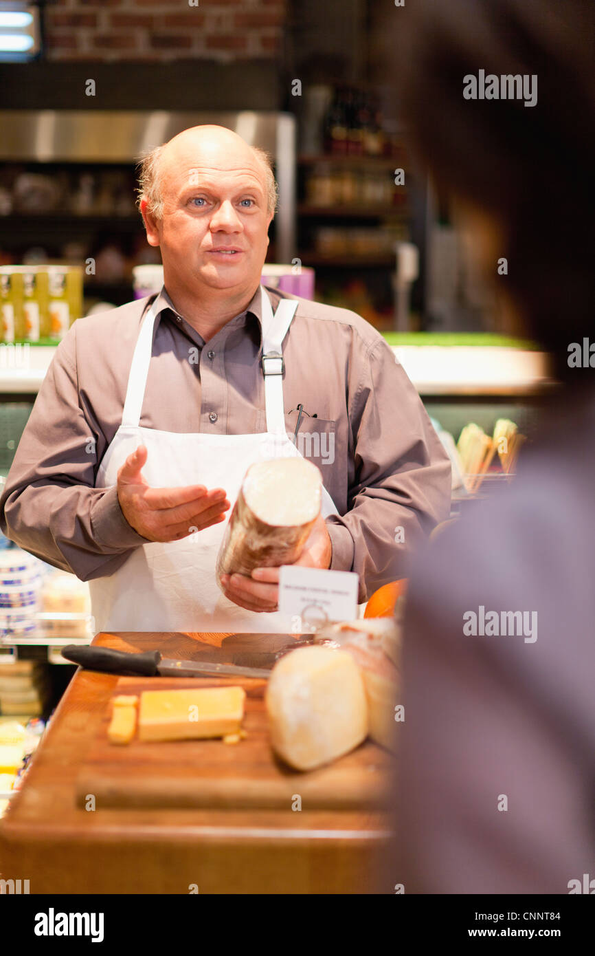 Man with free samples in grocery store Stock Photo Alamy