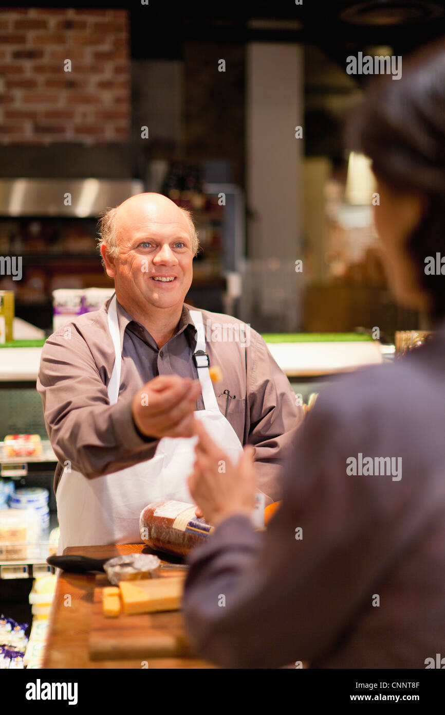 Helping free sample samples hi-res stock photography and images - Alamy