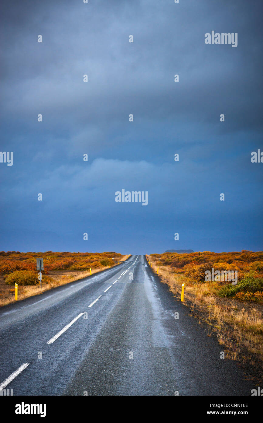 Dark Clouds over Road, Vesturland, Iceland Stock Photo