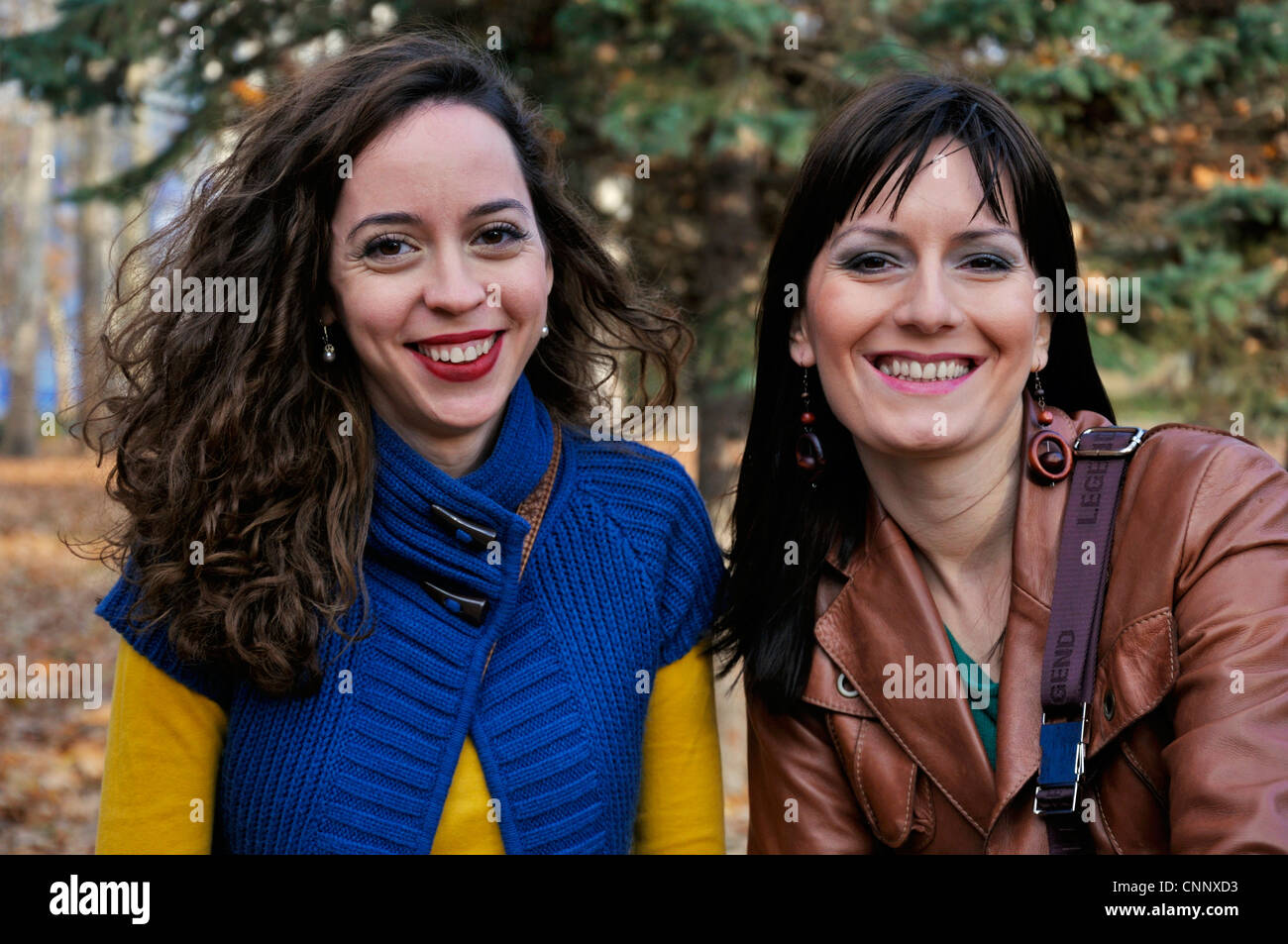 Portrait of two young women outdoors Stock Photo - Alamy