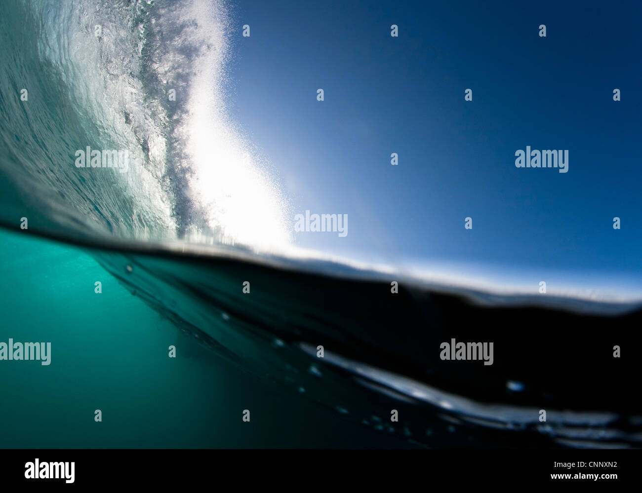 Wave crashing on water Stock Photo - Alamy