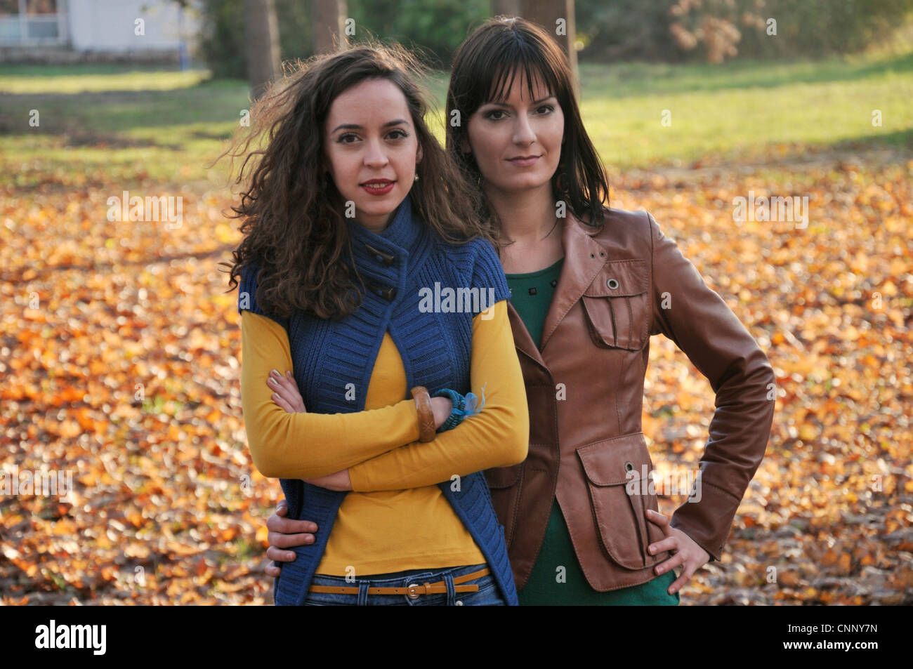 Portrait of two young women outdoors Stock Photo - Alamy