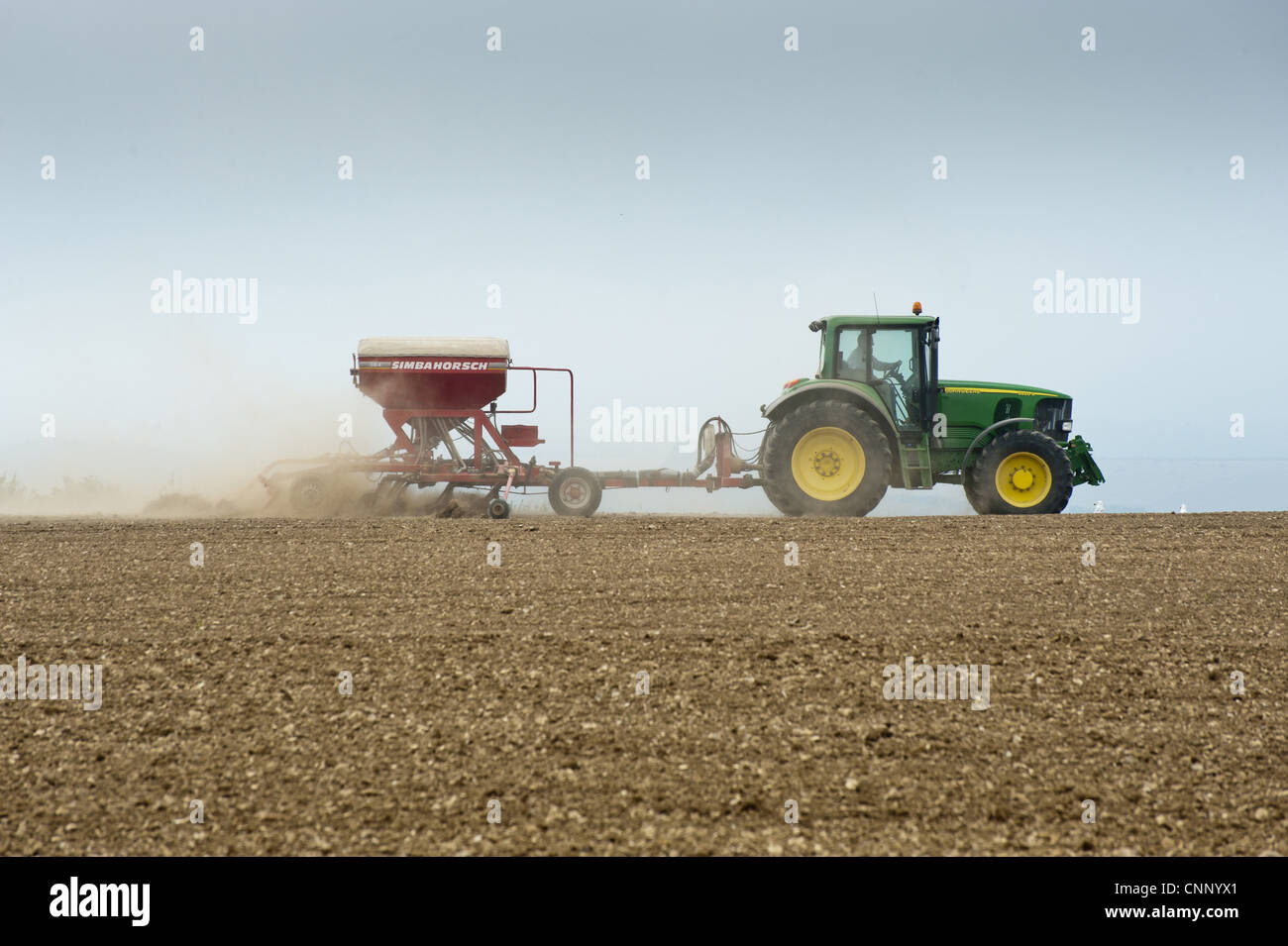 John Deere 6920S tractor with Simbahorsch CO 4 seed drill, drilling arable field, Frampton, Dorset, England, september Stock Photo