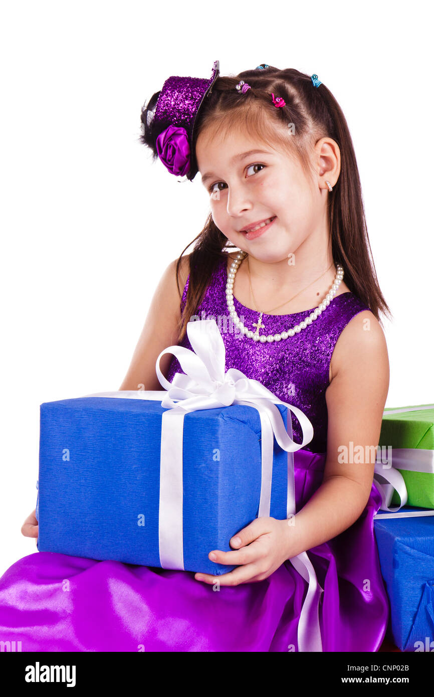 Beautiful little girl with presents over white background Stock Photo