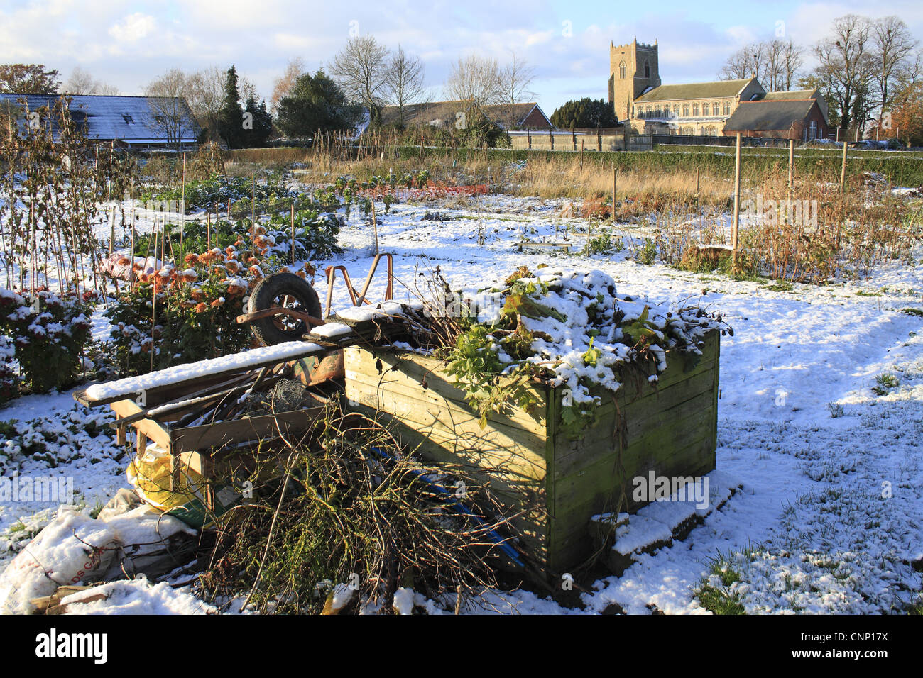 Composter Village Compost heap in snow covered village allotments church in background St ...