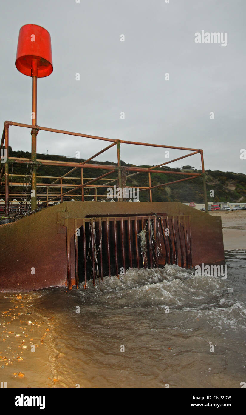 Combined sewer overflow (CSO), sanitary sewage and stormwater runoff discharged onto beach, Boscombe, Dorset, England, october Stock Photo