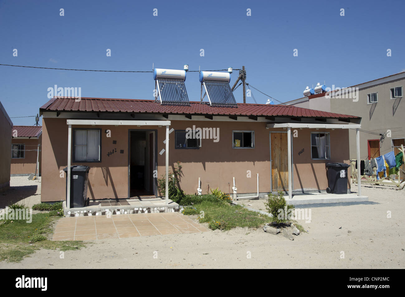 New housing with solar water heating on roof, Langa Township, Cape Town, Western Cape, South Africa Stock Photo