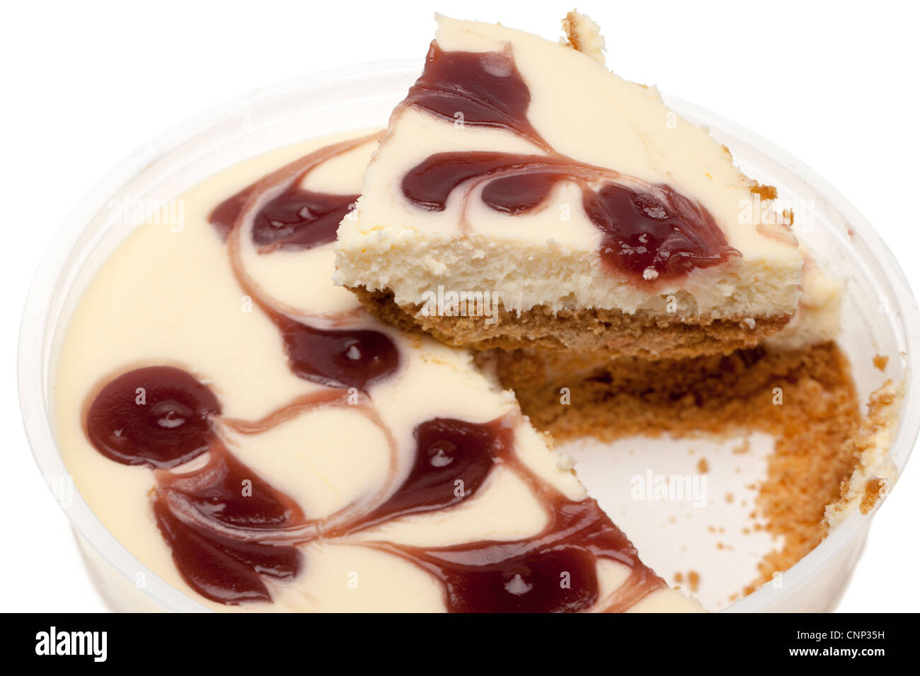 Strawberry flavour topped cheesecake in a plastic dish Stock Photo