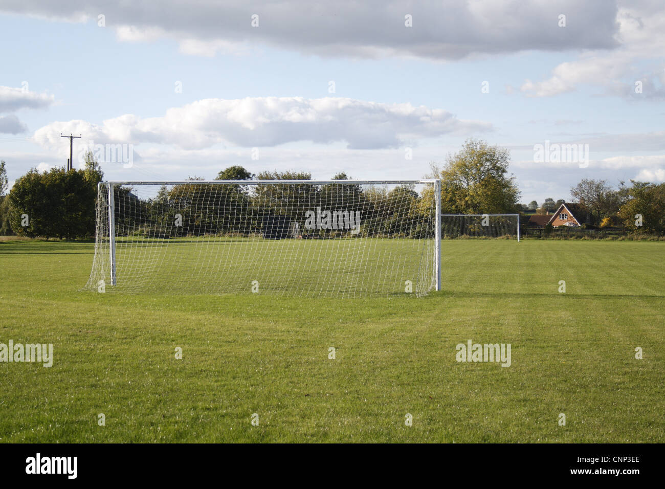 Goal posts on village football pitch, in evening sunshine, Bacton, Suffolk, England, october Stock Photo