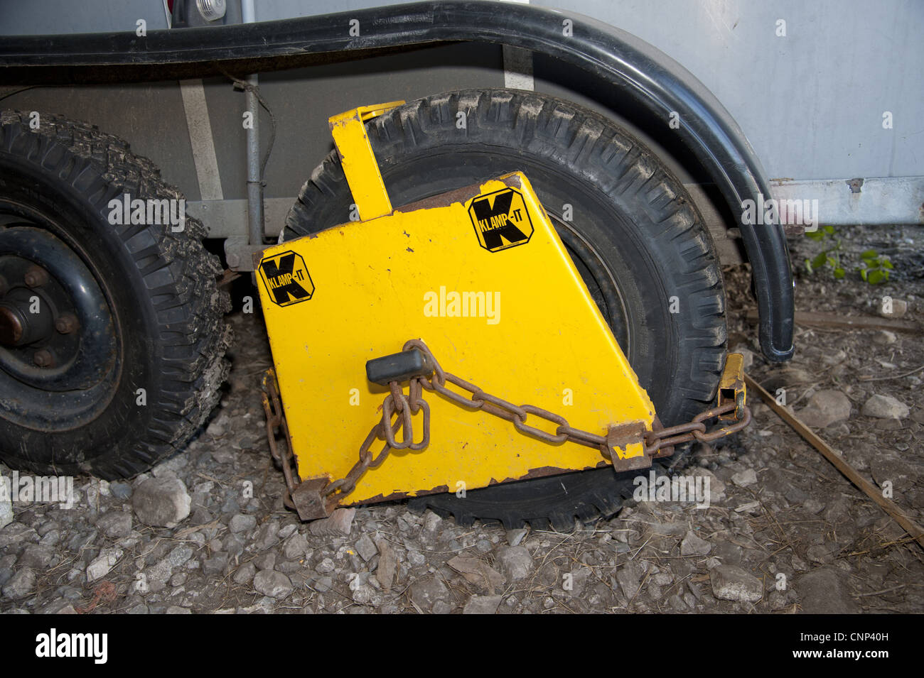 Horse box with security clamp on wheel to prevent theft, Whitewell, Lancashire, England, april Stock Photo