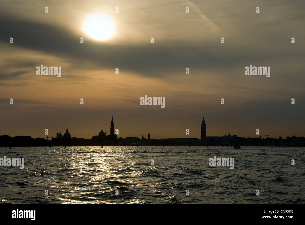 Venetian skyline silhouetted against a sunset sky Stock Photo - Alamy