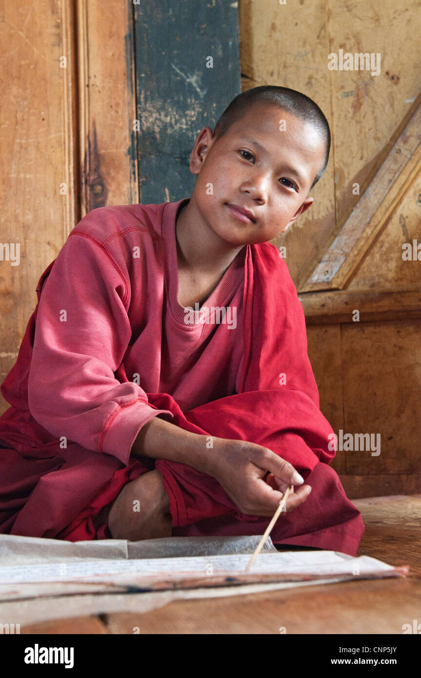 Asia, Bhutan. Close-up of young monk in the Temple of the Divine Madman Stock Photo