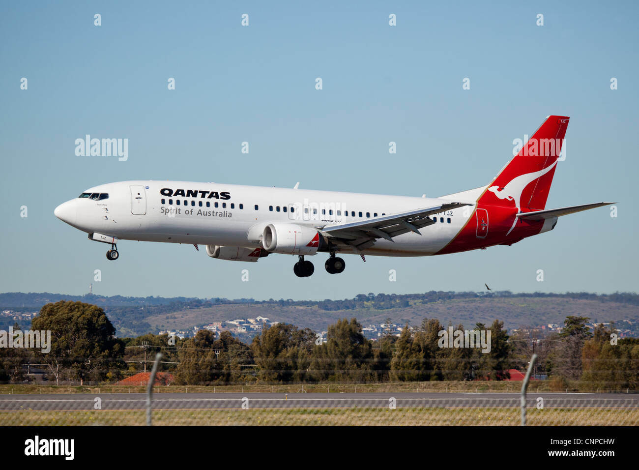Qantas jet landing at Adelaide Airport. Stock Photo