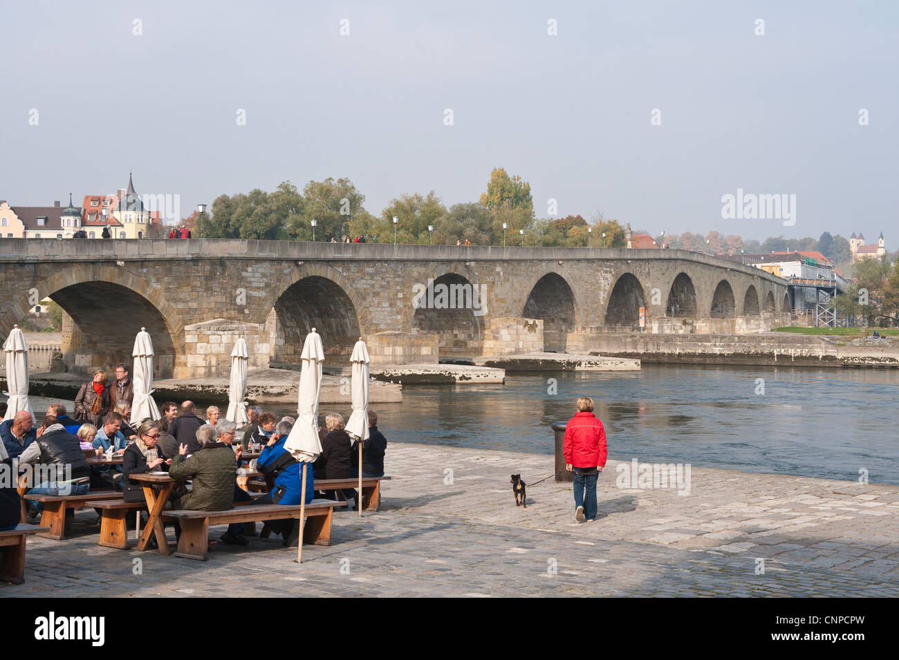Historic Roman Steinerne Brucke (bridge) over the Danube and the historic Sausage Kitchen restaurant Regensburg, Germany. Stock Photo