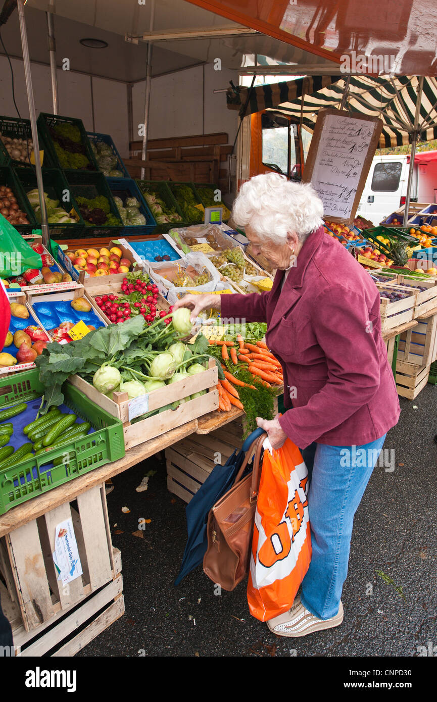 Mature lad shopping at the local farmers market in Zwiesel, Germany ...