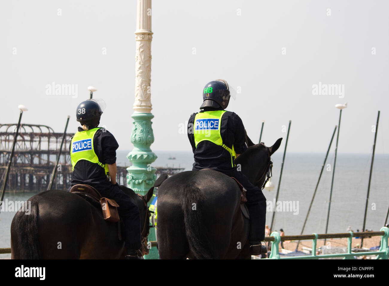 Two Police Officers on Police Horses patrolling Brighton Seafront after recent demonstrations by protesters. Stock Photo