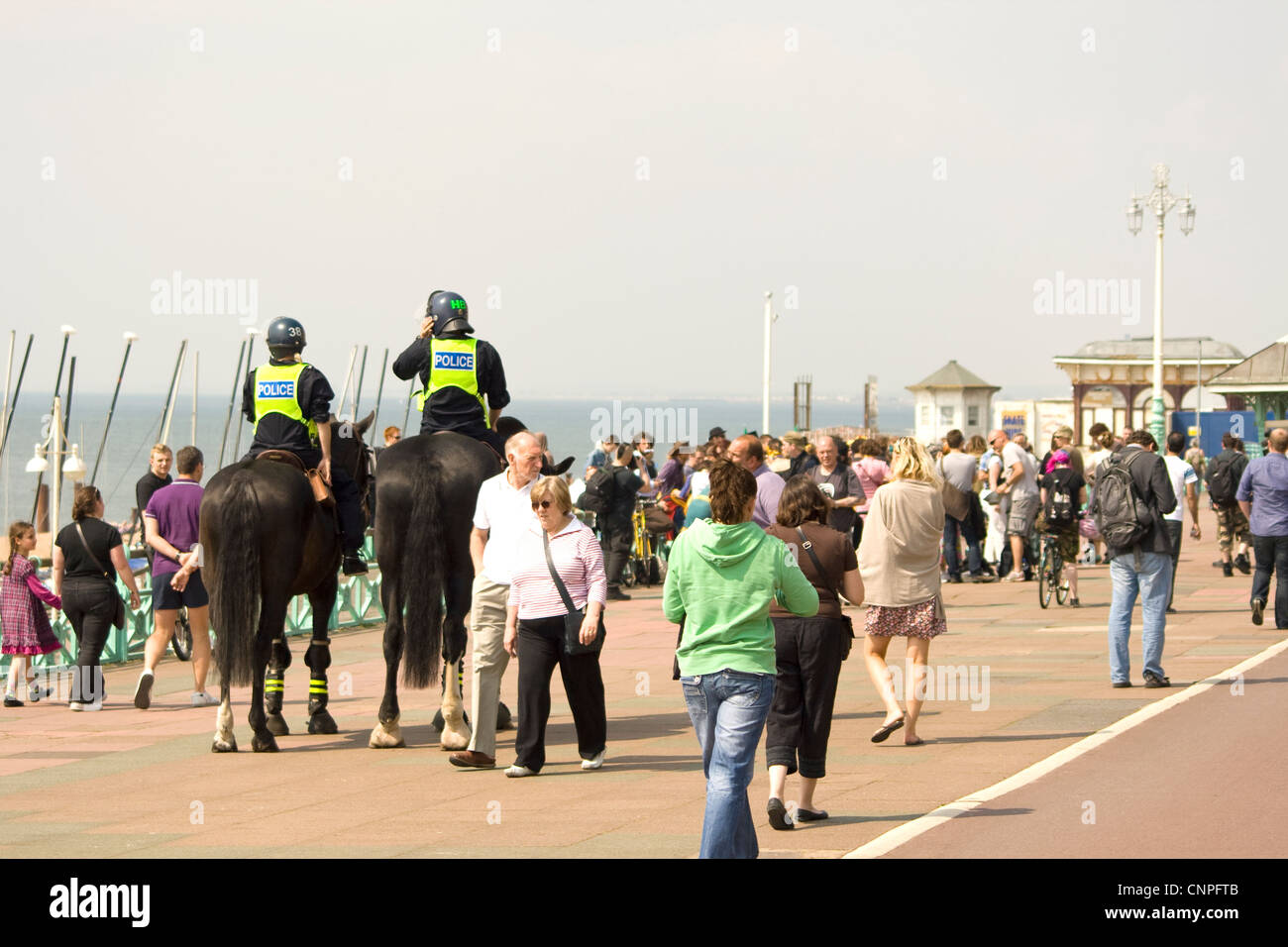 Police Officers on Police Horses patrolling Brighton Seafront after recent demonstrations by protesters. Stock Photo